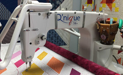 quilting on a longarm frame with Leah Day